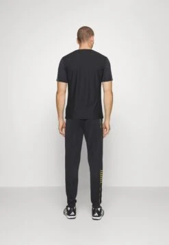 EA7 Emporio Armani Train Core Pants - Tracksuit Bottoms - Black/Gold -Total Wear Store 0dfd1403da054f98baa0ddc5eb02416f
