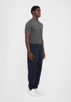 EA7 Emporio Armani TRAIN VISIBILITY - Tracksuit Bottoms - Blue/cream -Total Wear Store 0e6c009136ad48b58b88a37a74775aaa