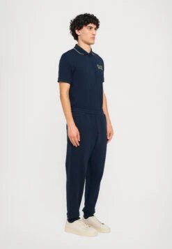 EA7 Emporio Armani TRAIN LOGOSERIES - Tracksuit Bottoms - Blue -Total Wear Store 0fe71f4bc48a4a81b5791b9e5b3a3b7b