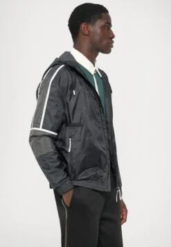 EA7 Emporio Armani TRAIN GRAPHIC SERIES M MONOGRAM - Windbreaker - Black Fancy -Total Wear Store 1aac28e5f2a543e8b0264229fd40992b