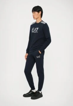 EA7 Emporio Armani TRAIN LINES - Tracksuit Bottoms - Blue -Total Wear Store 1f52863066234216bfc69d2ad10fc1c8