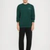 EA7 Emporio Armani TRAIN CORE UNISEX - Sweatshirt - Ponderosa Pine -Total Wear Store 25e6777a71b643659f65b3e994b4fd93