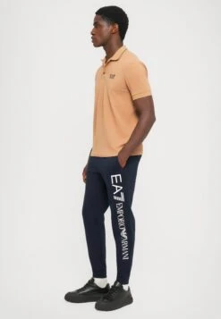 EA7 Emporio Armani TRAIN LOGO SERIES PANTS - Tracksuit Bottoms - Blue/white -Total Wear Store 3b5e740c13ee44fd8887d4c66998660d