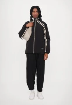 EA7 Emporio Armani TRAIN LOGO SERIES TAPE JACKET UNISEX - Outdoor Jacket - Black/gold Coloured