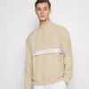 EA7 Emporio Armani Tennis Club Light - Long Sleeved Top - Oxford Tan -Total Wear Store 4fb5a6246a6144e289b282f190817c3e