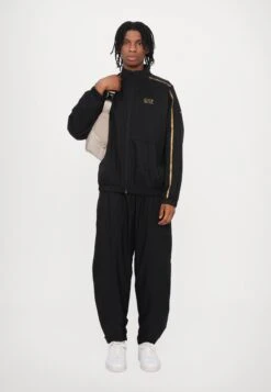 EA7 Emporio Armani VENTUS UNISEX SET - Tracksuit - Black/gold-coloured