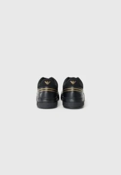 EA7 Emporio Armani PREMIUM COURT UNISEX - Trainers - Triple Black/gold-coloured -Total Wear Store 5d4acead6ccc41ca9864b5d1c3bae941