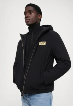 EA7 Emporio Armani TRAIN LABEL JACKETS - Winter Jacket - Black -Total Wear Store 638a732f90e64e09b9b686f5ddfc4569