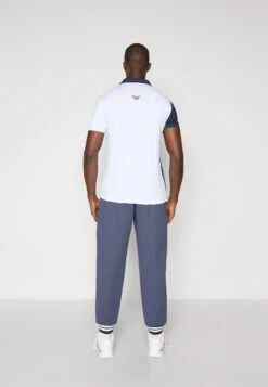 EA7 Emporio Armani TENNIS CLUB PANTS - Tracksuit Bottoms - Armani Blue -Total Wear Store 7498db709854419b9e35d746d4e203a9