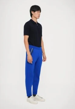 EA7 Emporio Armani Tracksuit Bottoms - Surf The Web -Total Wear Store 76ca9d5fdbe444f796ba78b36344db11