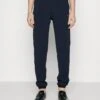 EA7 Emporio Armani Tracksuit Bottoms - Dark Blue -Total Wear Store 7ae41047fcd4495d84b6c06c12037b9f