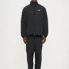 EA7 Emporio Armani TRAIN CORE - Tracksuit Bottoms - Black -Total Wear Store 7b426efde19847d19cb0003a7b4ee981