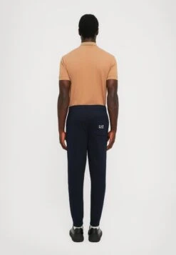 EA7 Emporio Armani TRAIN LOGO SERIES PANTS - Tracksuit Bottoms - Blue/white -Total Wear Store 8816a97c31ab4f72ad92b508889f9df7