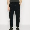 Emporio Armani Pantaloni - Tracksuit Bottoms - Nero -Total Wear Store 90a25574695342579ddda77f671ccfaf