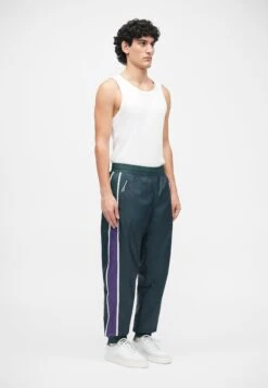 EA7 Emporio Armani TRAIN GRAPHIC SERIES PANTS MONOGRAM - Tracksuit Bottoms - Dark Green Fancy -Total Wear Store 93acc1e742e14d3b97c754e656522f07