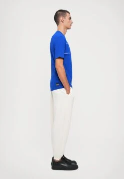 EA7 Emporio Armani TRAIN CORE PANTS UNISEX - Tracksuit Bottoms - Vanilla Ice -Total Wear Store 9ae798e57e714ce5a927fd48ac7a4996