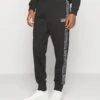 EA7 Emporio Armani Trouser - Tracksuit Bottoms - Nero -Total Wear Store a7cac7859dc04dac8bdbb056bed87b84