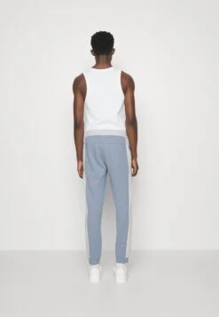 EA7 Emporio Armani Trouser - Tracksuit Bottoms - Light Blue -Total Wear Store aa63dbd18fa04c9d8a2ae93e0d2956ac