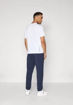 EA7 Emporio Armani SPORT PANTS - Tracksuit Bottoms - Blue -Total Wear Store ae710fcd1f074742b6344e71ee1dfaa2
