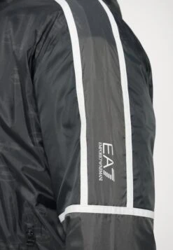 EA7 Emporio Armani TRAIN GRAPHIC SERIES M MONOGRAM - Windbreaker - Black Fancy -Total Wear Store b464e9ec08df4f4380ad253c26932be7