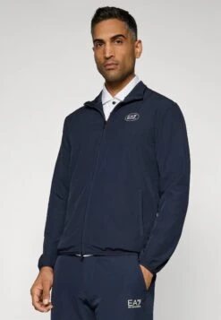 EA7 Emporio Armani GOLF PRO TECH - Training Jacket - Blue -Total Wear Store b5863368e2f7415abc8bae3e8a02ceef
