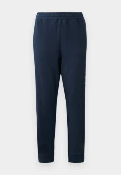 EA7 Emporio Armani TRAIN LOGOSERIES - Tracksuit Bottoms - Blue -Total Wear Store d132f4ce069440fa84889cf022885c06