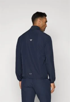 EA7 Emporio Armani GOLF PRO TECH - Training Jacket - Blue -Total Wear Store f7dcfd1c93474d5a8f2779db05eee89a
