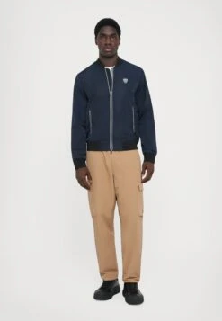 EA7 Emporio Armani TRAIN PREMIUM JACKET - Light Jacket - Blue -Total Wear Store fb93c96f3fd54318b9ed55a92a770fff