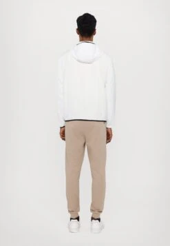 EA7 Emporio Armani TRAIN CORE JACKET - Light Jacket - White -Total Wear Store fbc2d64ee94940888227d2be563bded9